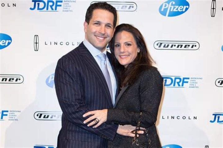 Adam Schefter with his wife