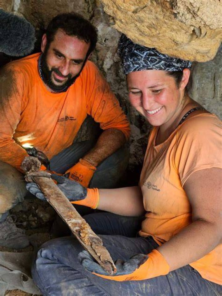 Archaeologists Removing Roman Swords
