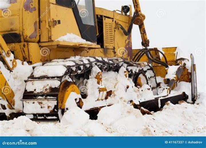 Bulldozer attempts to clear snow in Buffalo, NY.