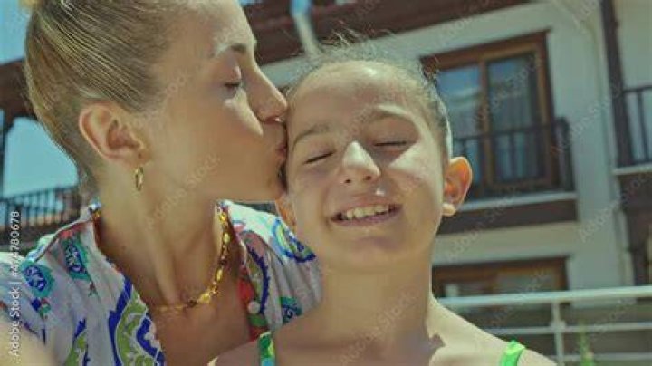 Friendly Gestures Kissing Mother