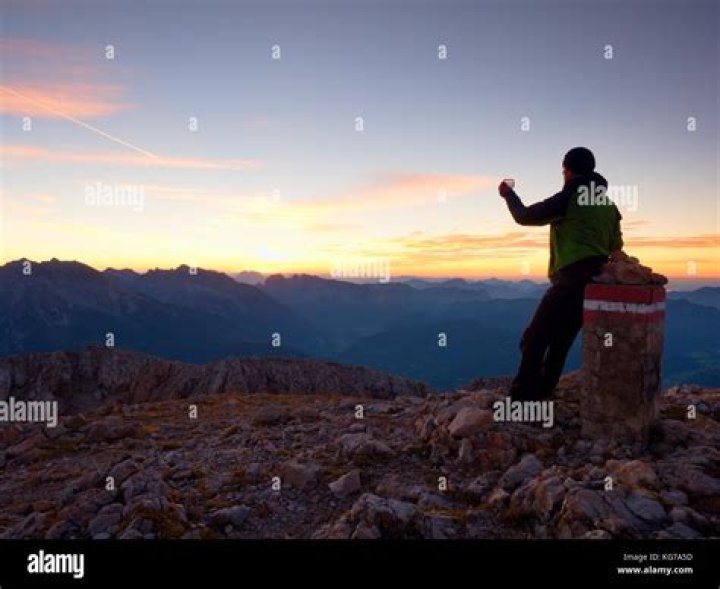 Hiker Takes Photo At The Into The Wild Bus
