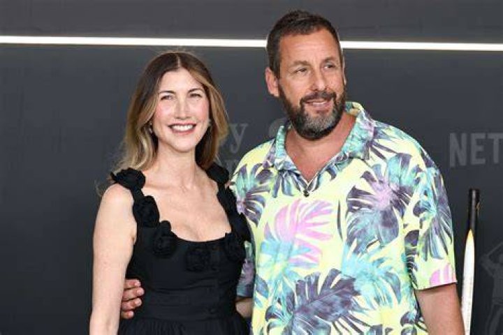 Jackie Sandler with her husband and daughters