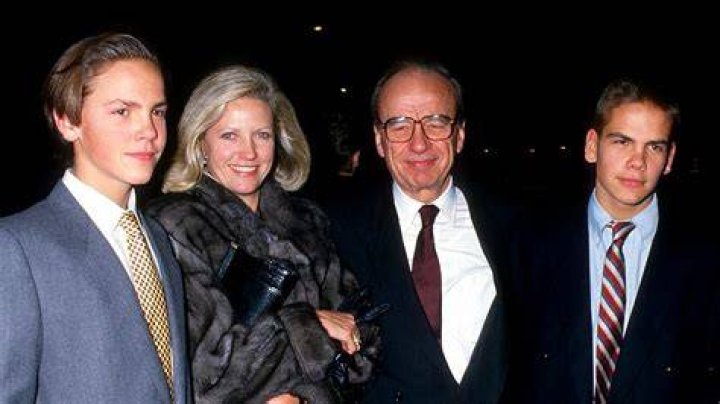 (L-R) James Murdoch, Anna Murdoch, Rupert Murdoch and Lachlan Murdoch attend 32nd Annual Art and Antique Show at Sotheby's in New York City on December 3, 1987