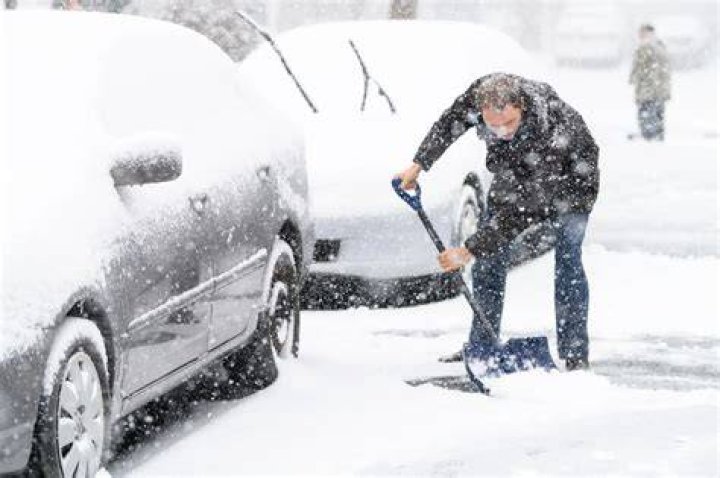 Man shovels out massive snowfall in Buffalo, NY.