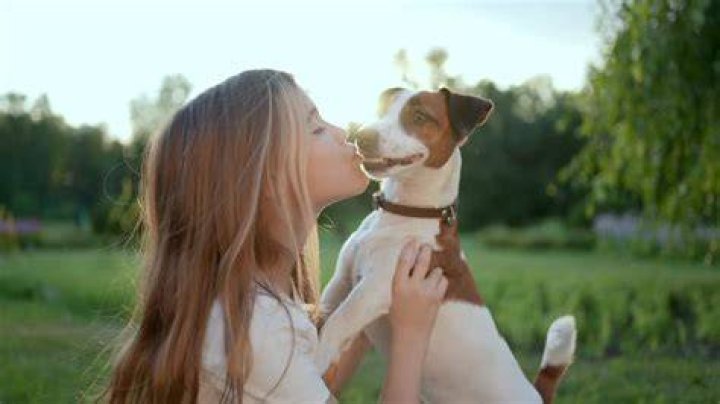 Nadia Chang Kissing Pet Dog