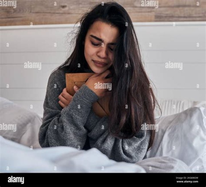 Sad Woman In Bed