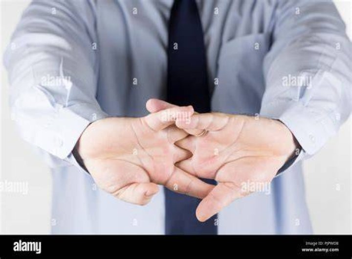 Shirtless Man Cracking Knuckles
