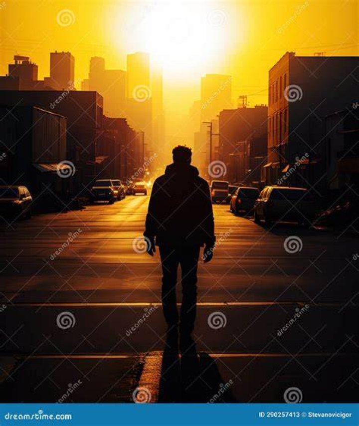 Walking down a street, abandoned due to blizzard conditions.