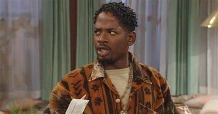Why was Kyle fired from Living Single?