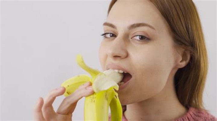 Woman Eating Banana