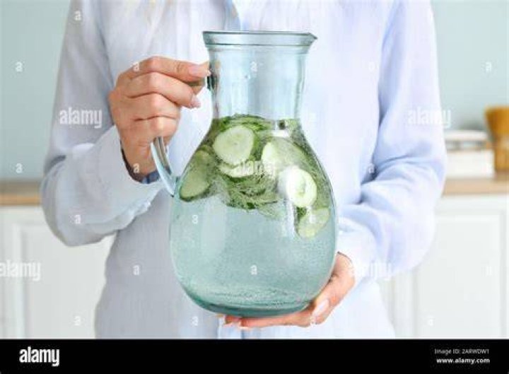 Woman Holding Live Water Jug